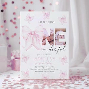 May include: Pink and white birthday invitation with a watercolor bow design. The invitation says "Little Miss One Derful" and includes the text "Join us to celebrate Isabella's first birthday 10-12-2024 at 3PM The Anderson Residence 123 Any Street RSVP Kelly 345-678-9000".