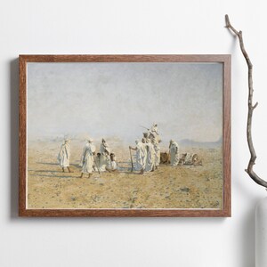 a framed painting of Bedouins in the desert