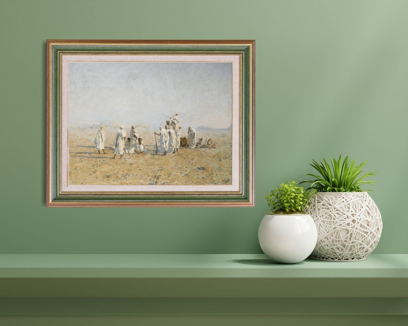 a framed painting of Bedouins in the desert
