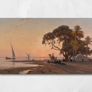 a framed picture of the artwork called Halt by the Well; by August Veillon. The image is of arab men and their camels in the desert next to a well and buildings.