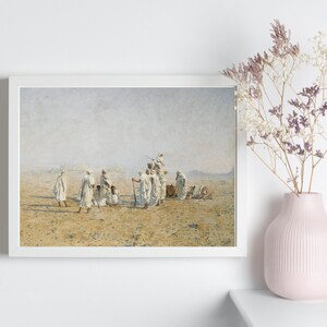 a framed painting of Bedouins in the desert