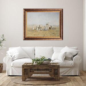 a framed painting of Bedouins in the desert