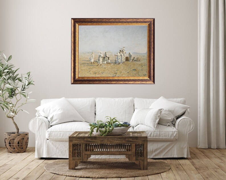 a framed painting of Bedouins in the desert