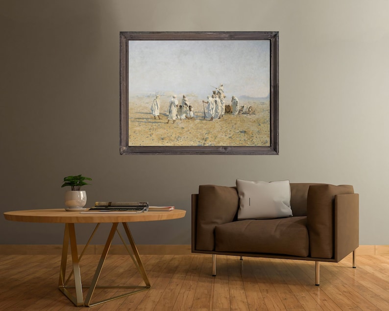 a framed painting of Bedouins in the desert