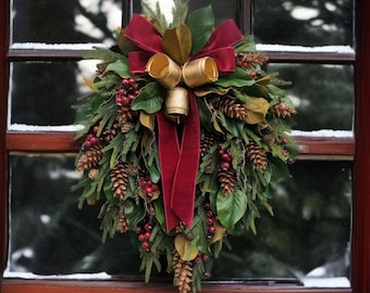 Traditional Cascading Christmas Wreath with Magnolia Leaves, Burgundy Ribbon, Gold Bells, Pinecones & Red Berries Elegant Holiday Door Decor