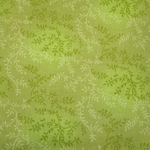May include: Green fabric with a white floral pattern of small branches and leaves.