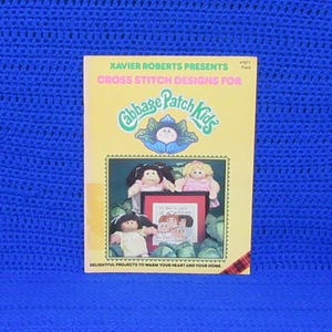 Vintage pattern booklet titled "Xavier Roberts Presents Cross Stitch Designs for Cabbage Patch Kids" # 7677