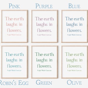 May include: Six framed art prints displaying the quote "The earth laughs in flowers" by Ralph Waldo Emerson. The prints are in pink, purple, blue, robin's egg, green, and olive hues. The frames are a light wood colour.