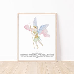 May include: Watercolor print of Saint Michael the Archangel, framed in a light wood. The artwork depicts an angel with blue and pink wings, holding a spear. The angel is dressed in gold and green. Text at the bottom reads "Saint Michael the Archangel".