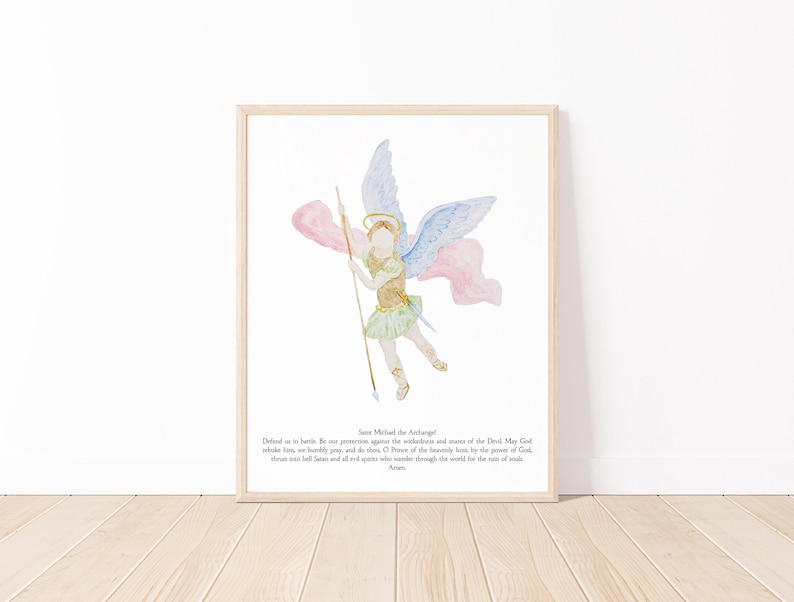 May include: Watercolor print of Saint Michael the Archangel, framed in a light wood. The artwork depicts an angel with blue and pink wings, holding a spear. The angel is dressed in gold and green. Text at the bottom reads "Saint Michael the Archangel".