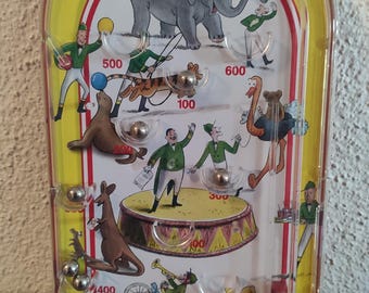 Flipper Schylling Curious George Blechspielzeug Kinderflipper