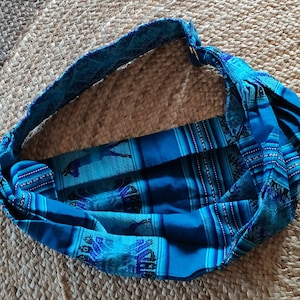 Sling porta-bebê confeccionado em tecido de algodão