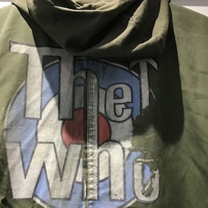 Parka verde vintage baseada na quadraphenia e na era cult da OMS, incluindo pátina e insígnia