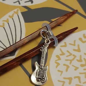 Guitar needle stopper/topper. Stitch keeper.