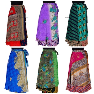 May include: Six different colorful wrap skirts made from recycled silk saris. Each skirt has a unique pattern and color combination. The skirts are all long and flowy, and they would be perfect for a variety of occasions.