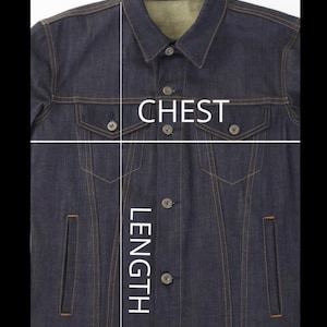 May include: A dark blue denim jacket with a button closure and two chest pockets. The jacket has a length measurement marked on the front.