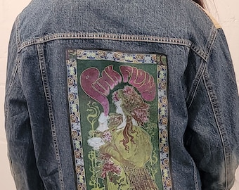 May include: A blue denim jacket with a vintage Pink Floyd concert poster patch on the back. The poster features a woman with flowers in her hair and the text "March 13, 66, The Marquee, London, England".