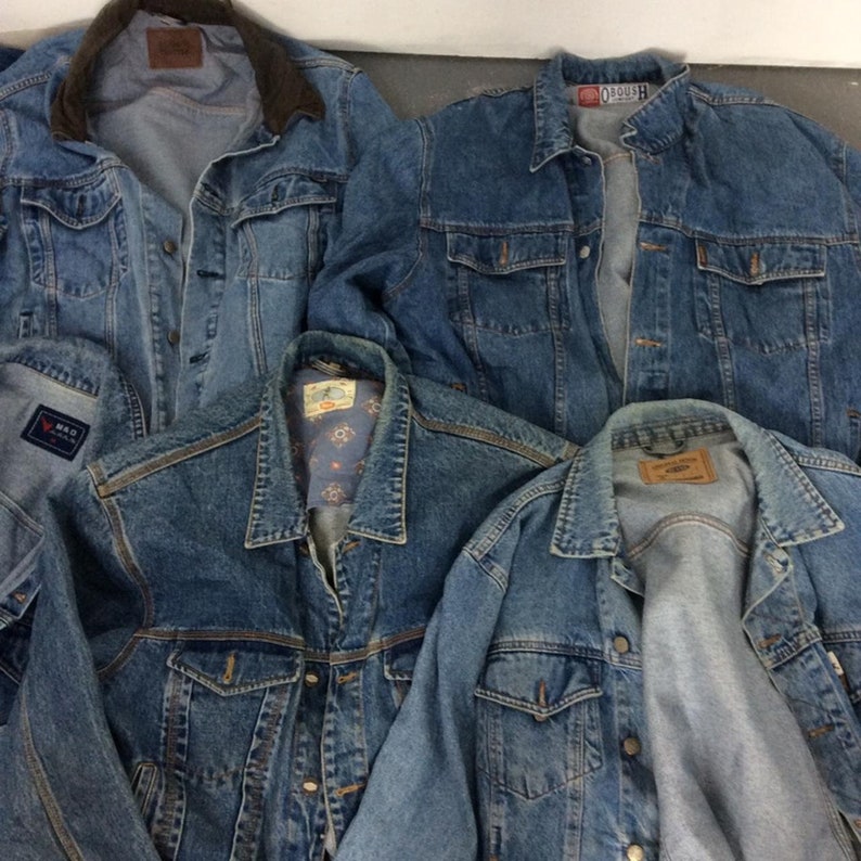 May include: Four denim jackets in various shades of blue. The jackets have different styles, including a corduroy collar, a patterned lining, and a classic design.