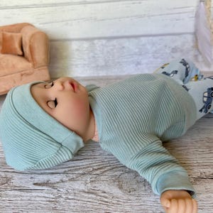 Puppenkleidung 36 cm Set: Pulli, Puppenhose, Mütze imagem 5