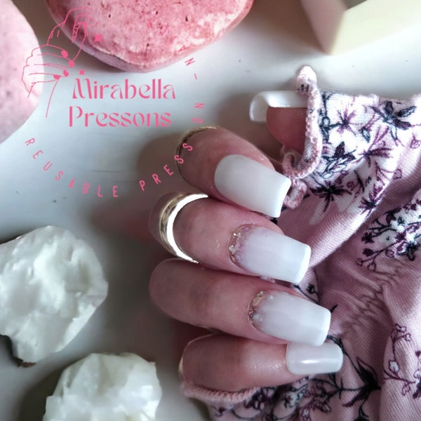 Milkshake - Milky white nails, with a subtle french manicure and a light pink glittery bottom.  Hand painted reusable gel nails.