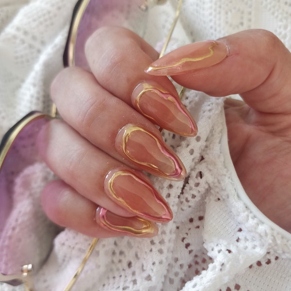 Cozy - Nude jelly almond press on nails, with pink and  gold chrome effect. Hand painted reusable gel nails.
