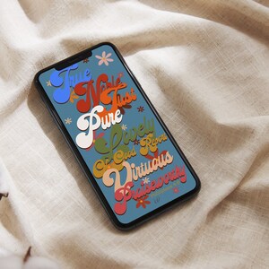 May include: A blue phone screen with a colorful graphic design featuring the words "True, Noble, Just, Pure, Lovely, Good Report, Virtuous, Praiseworthy" and the text "Philippians 4:8".