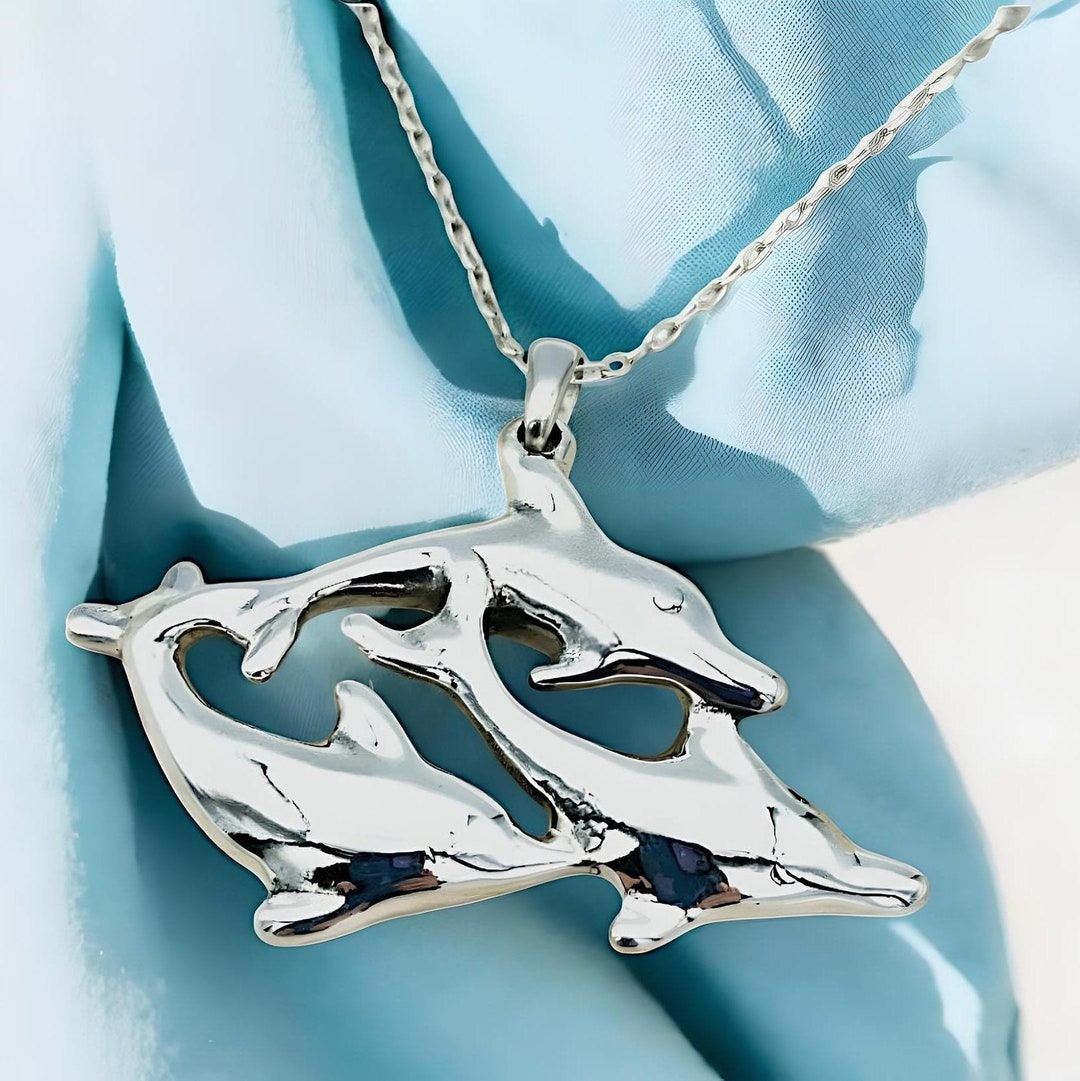 Pendentif en argent sterling monté sur chaîne composé de 2 dauphins