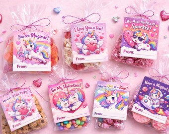 May include: Several clear cellophane bags tied with pink ribbon, each containing treats and a card with a unicorn design. The cards have phrases like "You are Magical!" and "Be My Valentine!" on a pink background.