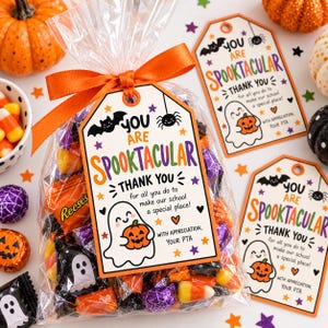 May include: A clear plastic treat bag filled with assorted candies, tied with an orange ribbon and a tag that reads: YOU ARE SPOOKTACULAR THANK YOU for all you do to make our school a special place! WITH APPRECIATION, YOUR PTA, featuring a ghost and bat.