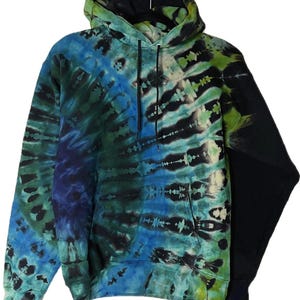 May include: A tie-dye hoodie in shades of blue, green, and black. The hooded sweatshirt features a front pocket and a drawstring. The tie-dye pattern is swirled and striped, creating a unique and colorful design.