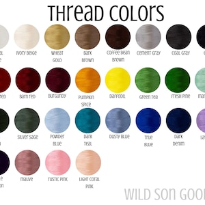 May include: A color chart displaying thread colors with names like "Natural White," "Brick Red," and "Dark Denim." The image includes a variety of shades, from light pastels to deep, rich tones, perfect for embroidery or crafting projects. The text "Thread Colors" is at the top.
