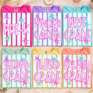 May include: Six t-shirts in pink, purple, blue, mint, yellow, and orange, each featuring a white and coloured vertical striped background with pink text reading Pre-K, Kindergarten, First Grade, Second Grade, Third Grade, and Fourth Grade.