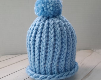 Sky blue handmade loom knitted newborn baby beanie hat with matching handmade pom