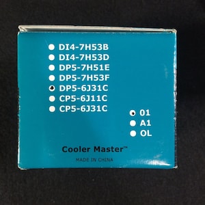 May include: A blue box with white text listing product codes: DI4-7H53B, DI4-7H53D, DP5-7H51E, DP5-7H53F, DP5-6J31C, CP5-6J11C, CP5-6J31C. The box also has white text that says "Cooler Master&trade;" and "MADE IN CHINA". There are three white circles with black text: 01, A1, and OL.