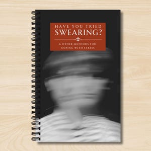 May include: A black and white spiral bound notebook with a red title that reads "Have You Tried Swearing? & Other Methods for Coping With Stress".