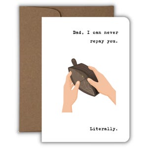 May include: A white greeting card with the text "Dad, I can never repay you. Literally." The card features an illustration of a brown wallet being held open by two hands, set against a brown envelope.