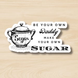 May include: White sticker with black text that reads "Be your own Daddy make your own SUGAR" with a black and white illustration of a sugar bowl.