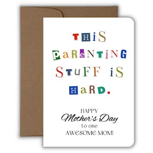 May include: A white card with the text "This parenting stuff is hard. Happy Mother's Day to one awesome mom!" in colorful, cut-out letters.