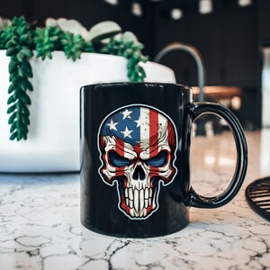 May include: Black ceramic mug with a graphic of a skull wearing an American flag. The skull has red, white, and blue colors.