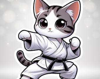 May include: A sticker of a cartoon cat in a karate uniform. The cat is white and grey with large eyes and is posed in a karate stance. The uniform is white with a black belt.
