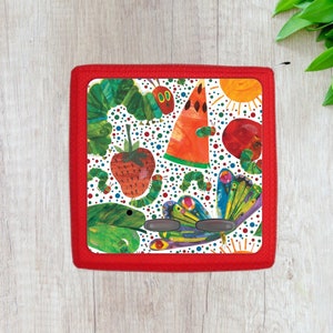 May include: Red rectangular case with a white background featuring a colorful illustration of a caterpillar, butterfly, watermelon, strawberry, and other objects. The case has a red border and three buttons.