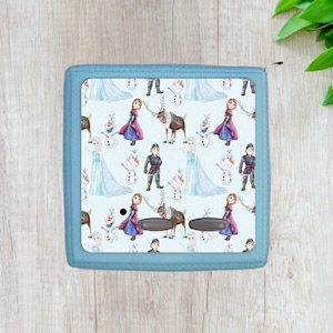 May include: A blue zippered pouch with a repeating pattern of Frozen characters, including Elsa, Anna, Olaf, Kristoff, and Sven. The characters are depicted in a watercolor style on a light blue background.