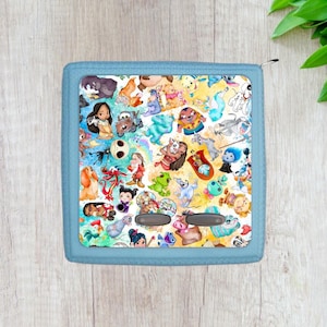 May include: A blue zippered pouch with a colorful print of various Disney characters, including Mickey Mouse, Stitch, and Moana. The print is a mix of watercolor and cartoon styles.