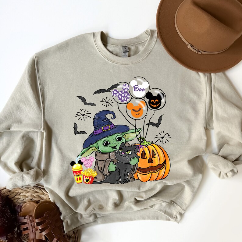 👻🎃 Trick or Treat with The Cutest Force in the Galaxy! 👽🧡

Celebrate Halloween the Mandalorian way with this adorable Baby Yoda Trick or Treat Shirt! Whether you're heading out for candy, hosting a Halloween party, or just binge-watching spooky movies, this tee or sweatshirt will keep you looking cute and comfy all season long! 🍬🕸️
