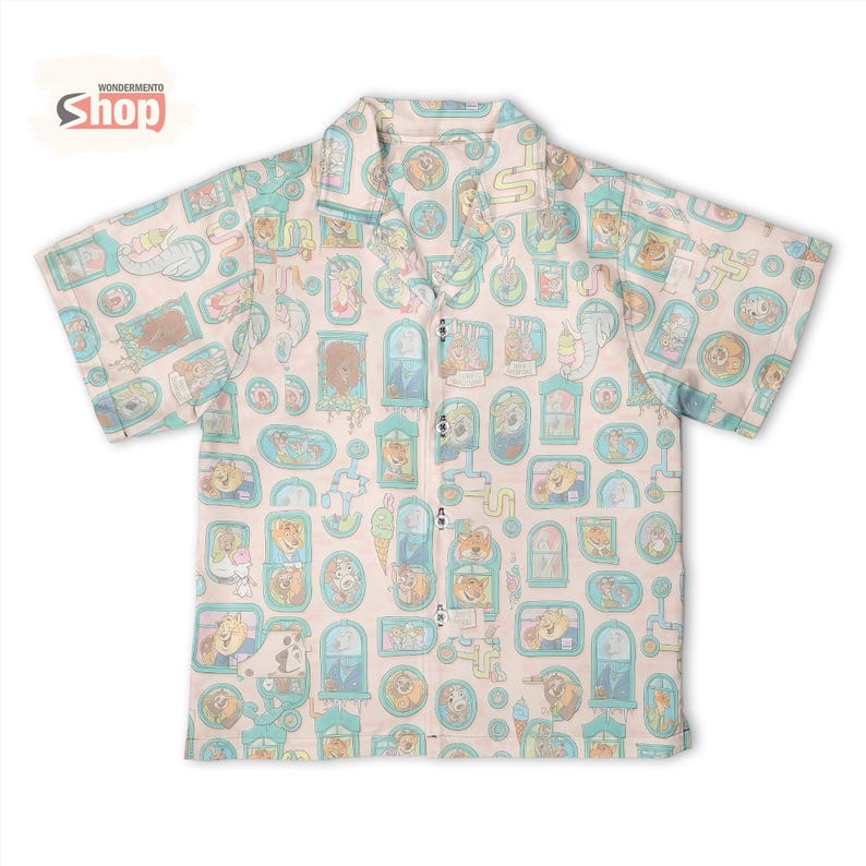 May include: A short-sleeved button-up shirt with a light pink background and a repeating pattern of cartoon dogs in various settings. The shirt has a collared neckline and the text "WONDERMENTO Shop" is visible.