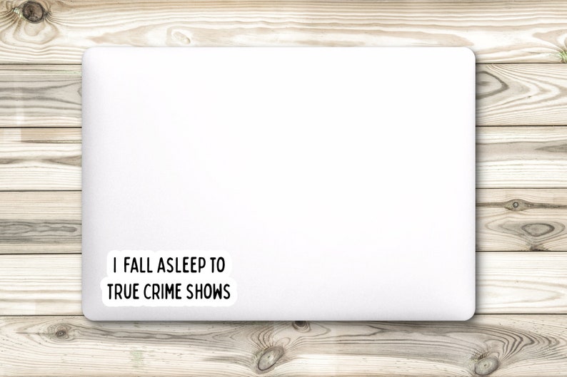 May include: White laptop with a sticker that says "I fall asleep to true crime shows".