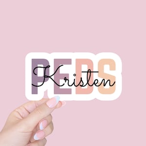 May include: A sticker with the word "PEDS" in pink, orange, and purple with the name "Kristen" written in black cursive.