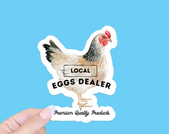 May include: A white and brown chicken with a red comb and wattle. The chicken is standing on a white background with the text "LOCAL EGGS DEALER" and "Premium Quality Products".