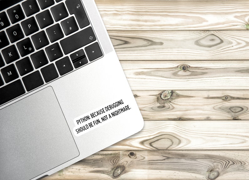 May include: A silver laptop computer with a black keyboard and a white sticker on the back that says "PYTHON: BECAUSE DEBUGGING SHOULD BE FUN, NOT A NIGHTMARE."