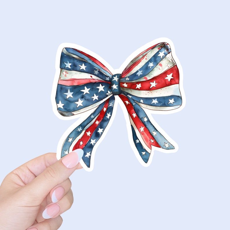May include: A red, white, and blue bow with stars and stripes, reminiscent of the American flag.